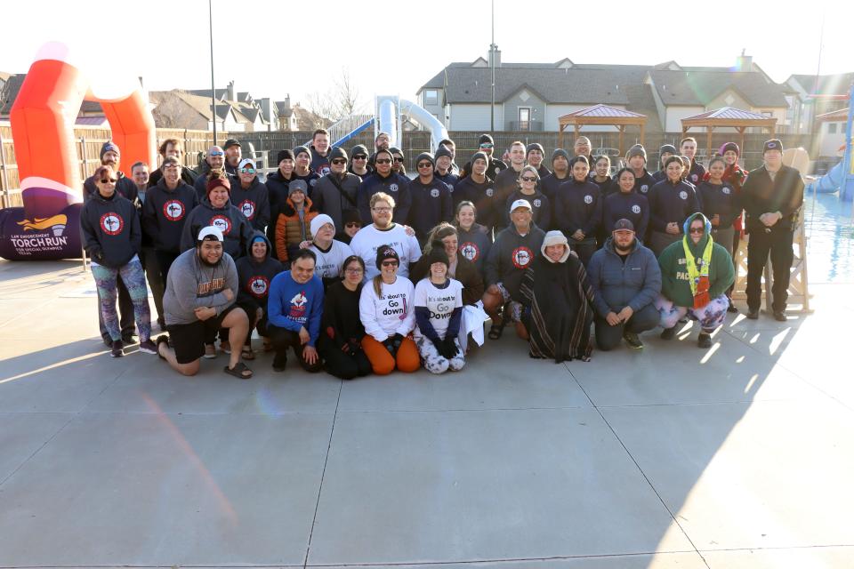 Participants get a group photo before the annual Special Olympics Polar Plunge held at Amarillo Town Club on Hillside Saturday morning.