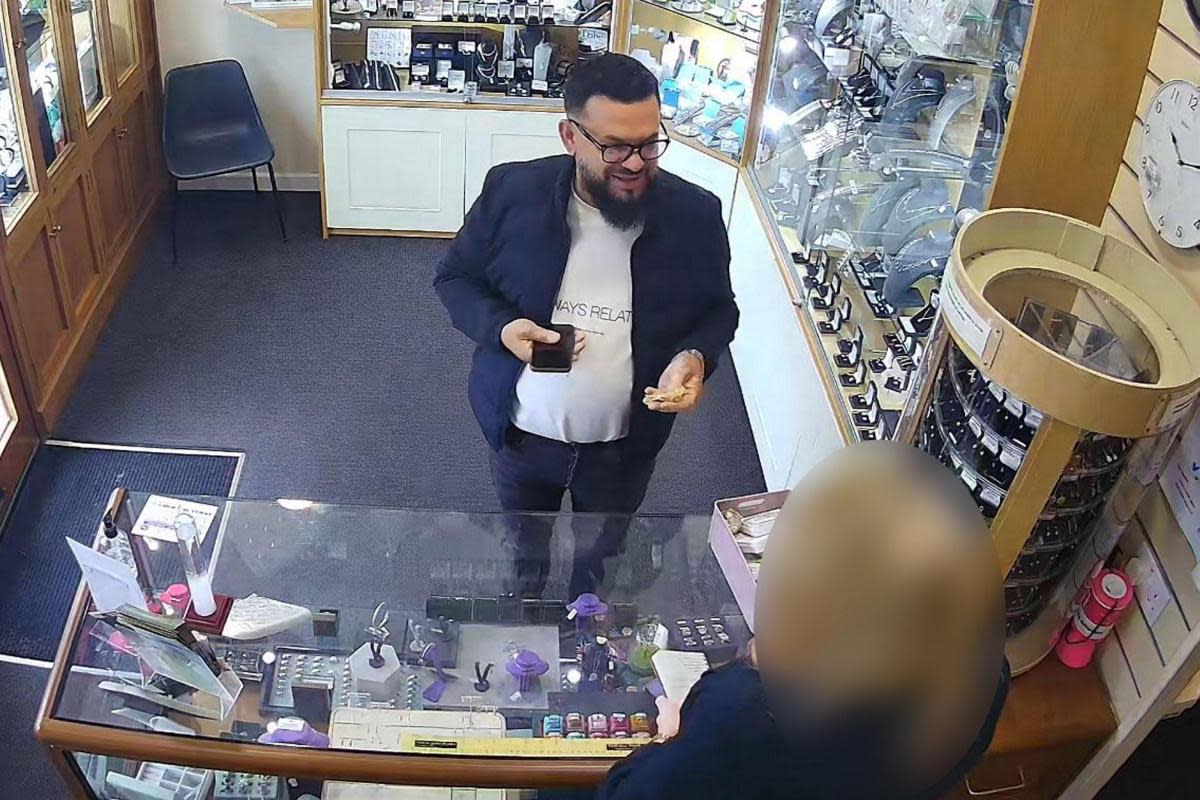 An alleged 'gold swap fraudster' caught on camera in Hailsham <i>(Image: SWNS)</i>