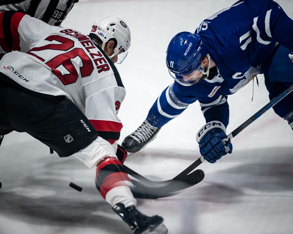 Utica's Ryan Schmelzer and Toronto's Logan Shaw battle during a face-off at the Adirondack Bank Center in Utica on Friday, May 5, 2023. Toronto defeated Utica 4-1, eliminating the Comets from the playoffs.