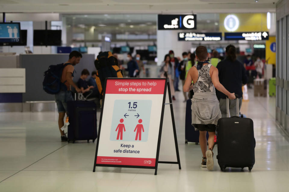 Health advice notices are seen at Sydney International Airport on March 25, 2020. Source: Getty