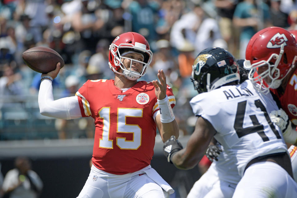FILE - In this Sept. 8, 2019, file photo, Kansas City Chiefs quarterback Patrick Mahomes (15) throws a pass as he is pressured by Jacksonville Jaguars defensive end Josh Allen during the first half of an NFL football game in Jacksonville, Fla. Mahomes Mahomes is the reigning league MVP. (AP Photo/Phelan M. Ebenhack, File)