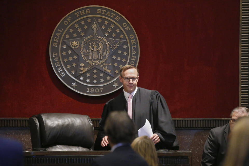 Judge Thad Balkman arrives to give his decision in the Opioid Lawsuit in Norman, Okla., Monday, Aug. 26, 2019. Balkman found Johnson & Johnson and its subsidiaries helped fuel the state's opioid drug crisis and ordered the consumer products giant to pay $572 million to help abate the problem in the coming years. (AP Photo/Sue Ogrocki, Pool)