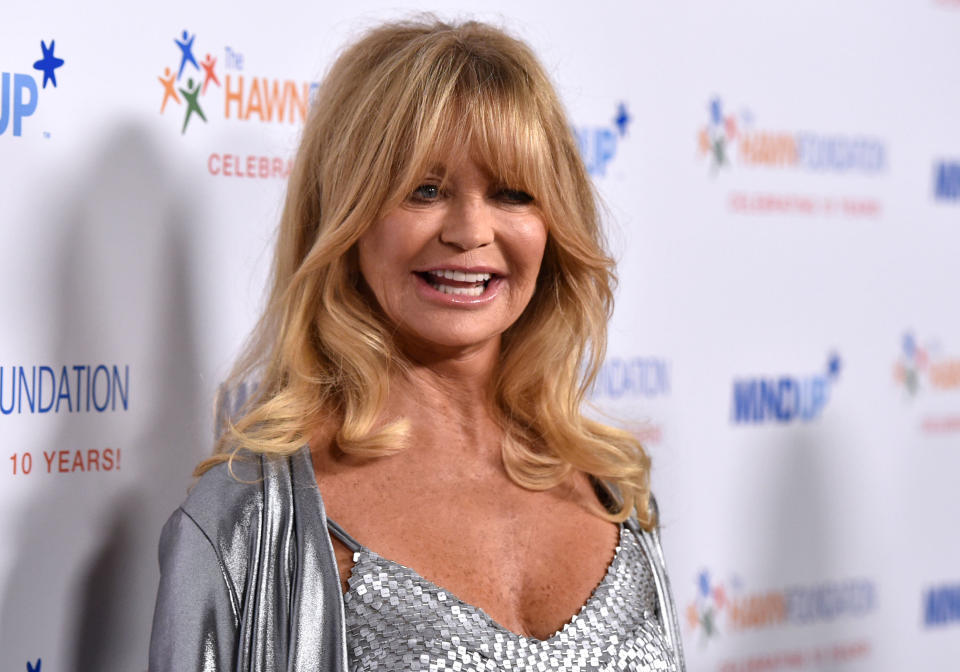 It's hard to believe that Goldie Hawn will be turning 70 later this year! Hawn has<a href="http://ca.eonline.com/news/440576/goldie-hawn-tweets-about-arrival-of-granddaughter-rio-oliver-hudson-s-third-child" target="_blank"> five grandchildren</a>, three from her son, actor Oliver Hudson, and two from her lookalike daughter, Kate Hudson. <br><br> Though Hawn was elated at the arrival of her grandchildren, she admits she wasn't so happy about being labeled a grandma. In her memoir, <a href="http://www.nytimes.com/2011/05/12/fashion/noticed-who-are-you-calling-grandma.html?_r=0" target="_blank">"A Lotus Grows In The Mud,"</a> Hawn said the term has "connotations of old age and decrepitude.” She added that Oliver "decided I should be called ‘Glam-Ma,’ which I thought was quite brilliant and made us all laugh so hard.” Glam-Ma Goldie kind of has a ring to it, don't you think?