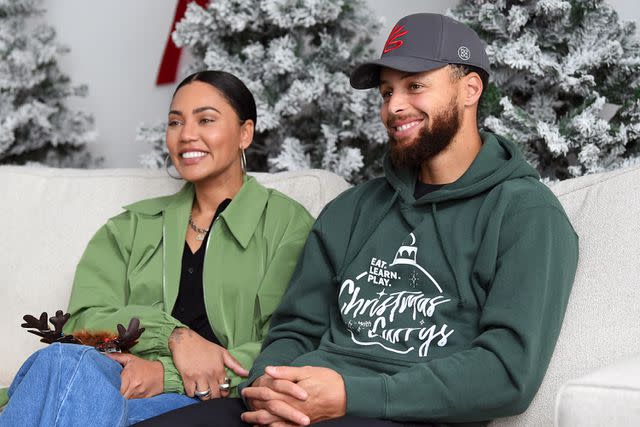 <p>Noah Graham/Getty</p> Ayesha Curry and Stephen Curry attend Eat. Learn. Play.'s 10th Annual Christmas with the Currys Celebration at The Bridge Yard on December 11, 2022