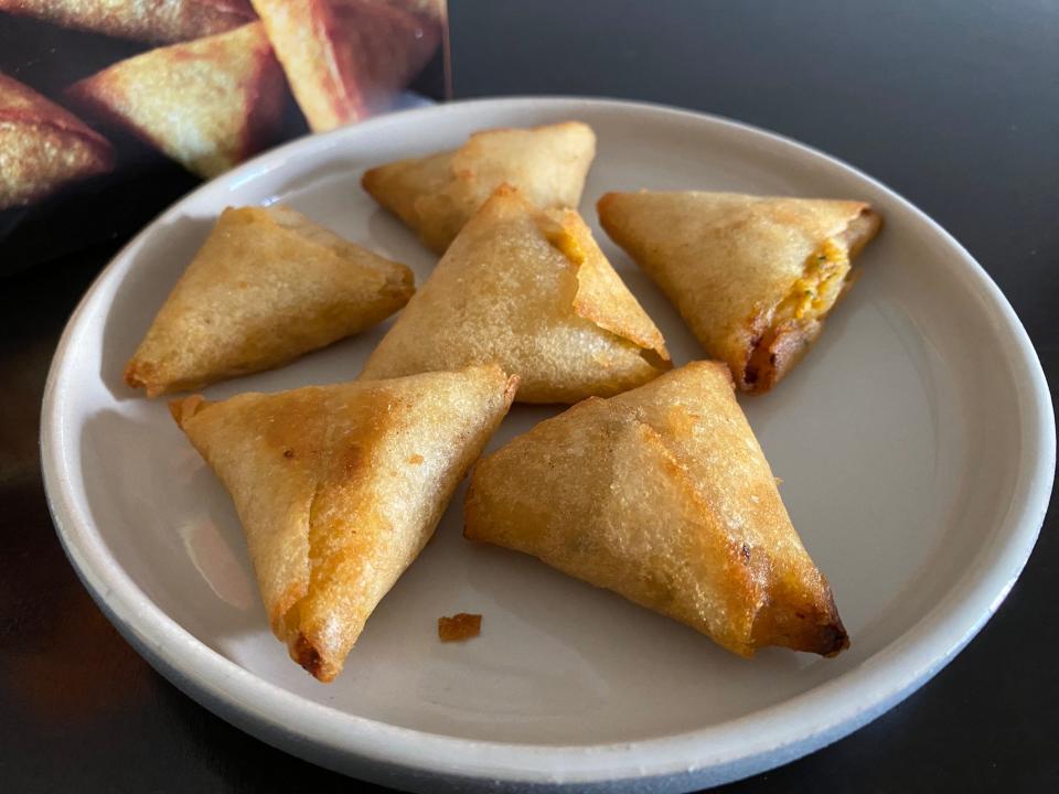 Crispy gold triangles on a white plate