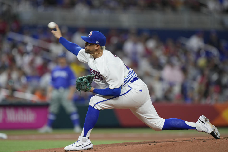 Puerto Rico's Jose De Leon delivers a pitch during the first inning of a World Baseball Classic game against Israel, Monday, March 13, 2023, in Miami. (AP Photo/Wilfredo Lee)