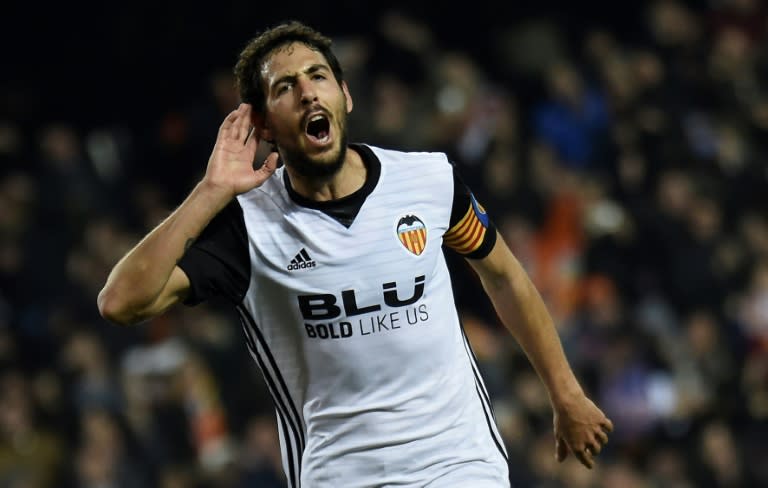 Valencia's midfielder Dani Parejo celebrates after scoring against Celta Vigo at the Mestalla Stadium in Valencia on December 9, 2017