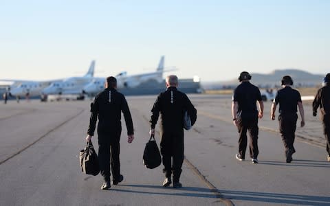 Pilots Mark “Forger” Stucky and Dave Mackay walk to the aircraft  - Credit: Virgin Galactic 