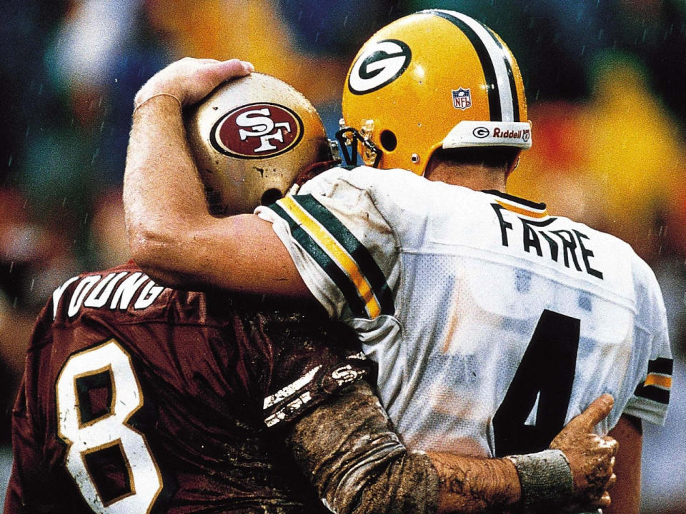 Steve Young and Brett Favre after the 1997 NFC title game. (Mickey Pfleger/Getty Images)