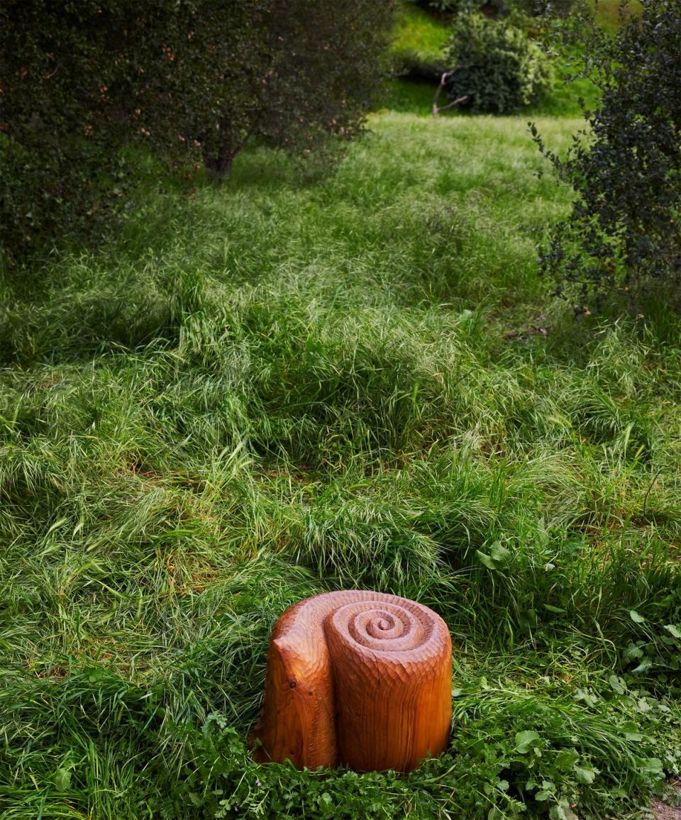 a wood stool in a field