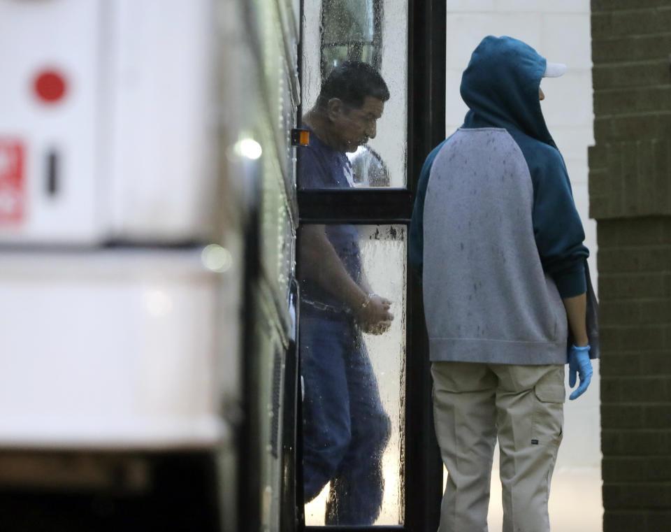 Immigrants in handcuffs and ankle chains arrive at the Federal Courthouse in McAllen, Texas, for hearings on June 21, 2018. (Photo: ASSOCIATED PRESS)