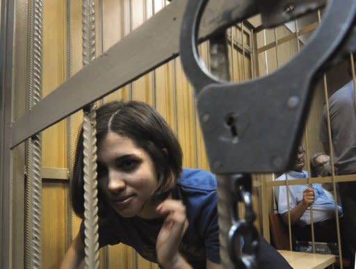 Nadezhda Tolokonnikova, a member of Russian punk band Pussy Riot, sits inside a defendant's cage in a Moscow court on July 4. The trial of three members of the all-girl punk band charged for performing an anti-Vladimir Putin song in the country's main cathedral has gripped Russians, some describing the court drama as better than the theatre