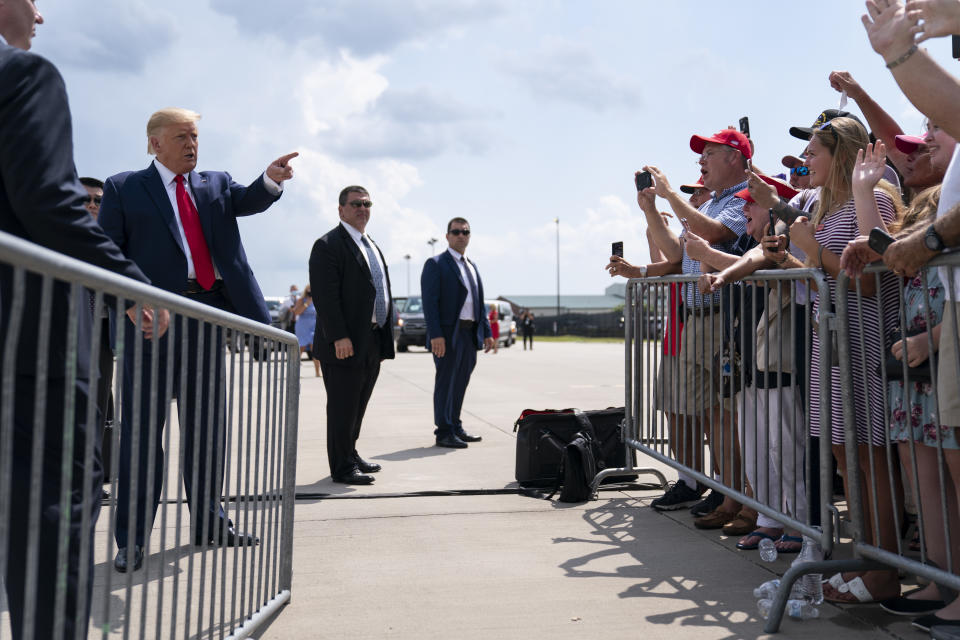 President Donald Trump talks to a crowd of supporters after arriving at Wilmington International Airport, Wednesday, Sept. 2, 2020, in Wilmington, N.C. (AP Photo/Evan Vucci)