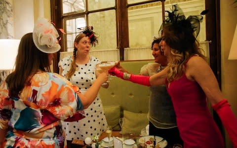 Guests toast at a Viewing Party at New York's Plaza Hotel  - Credit: Getty