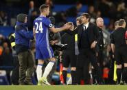 Britain Football Soccer - Chelsea v Southampton - Premier League - Stamford Bridge - 25/4/17 Chelsea manager Antonio Conte celebrates after the match with Gary Cahill Action Images via Reuters / John Sibley Livepic