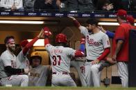 Philadelphia Phillies' Odubel Herrera is congratulated after hitting a home run during the fifth inning of a baseball game against the Milwaukee Brewers Wednesday, June 8, 2022, in Milwaukee. (AP Photo/Morry Gash)