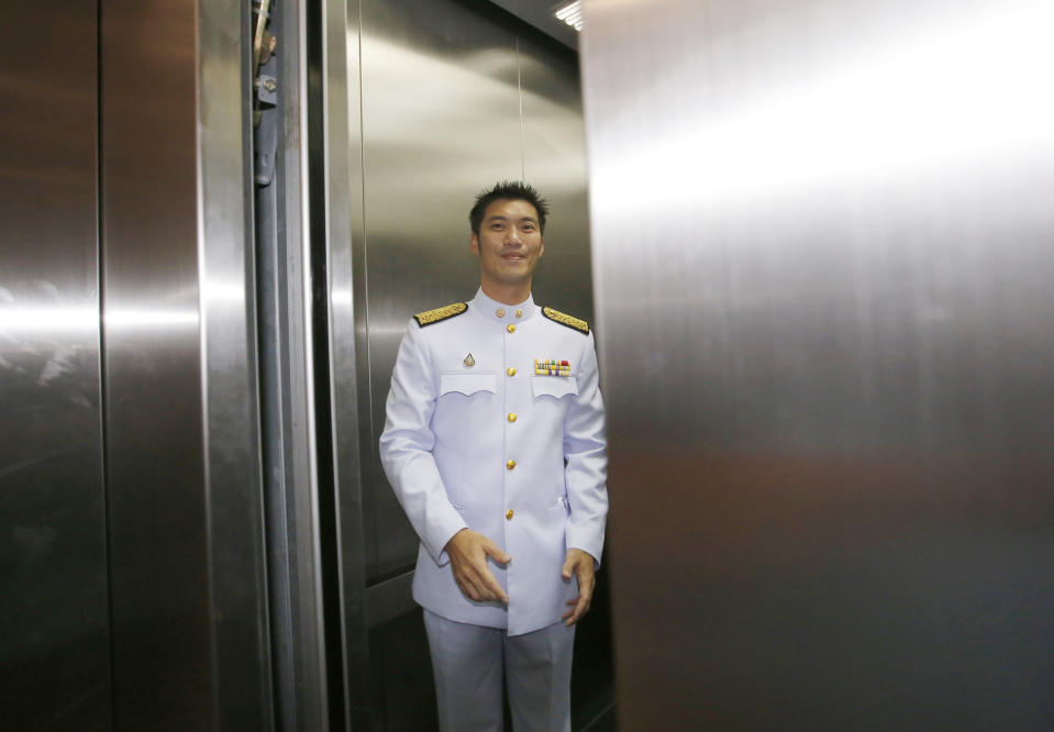 Thailand's Future Forward Party leader Thanathorn Juangroongruangkit gets inside an elevator after arriving at parliament in Bangkok, Thailand, Friday, May 24, 2019. Thailand's King Maha Vajiralongkorn plans to officially open parliament following the first democratic election since a coup five years ago. (AP Photo/Sakchai Lalit)