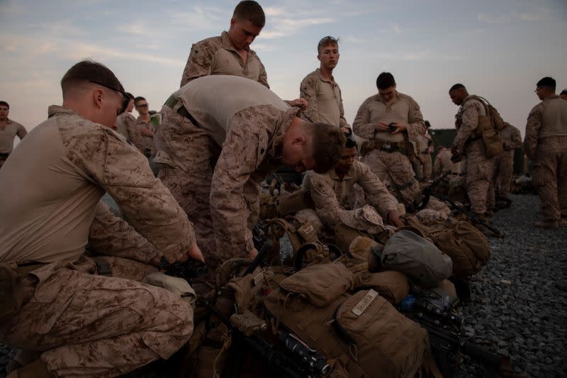 U.S. Marines assigned to Special Purpose Marine Air-Ground Task Force-Crisis Response-Central Command 19.2 prepare to deploy to reinforce Baghdad's U.S. embassy from a base in Kuwait