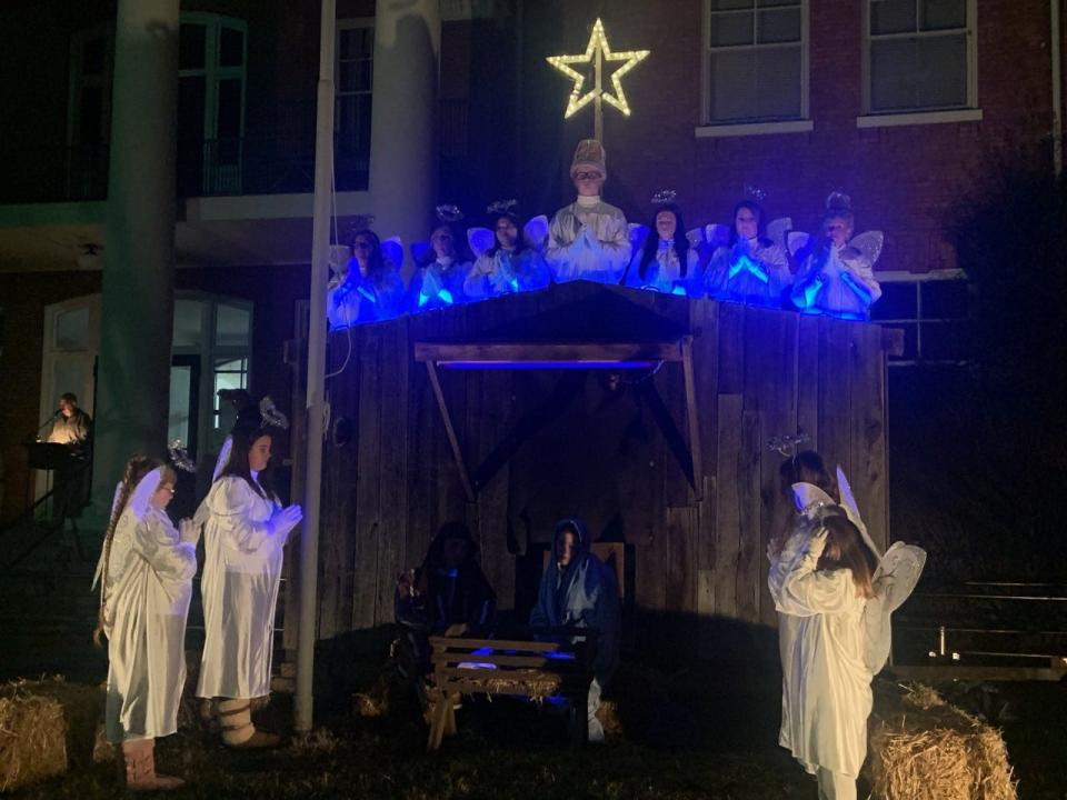 The Marshall Christmas Pageant's angels join in prayer Dec. 3.