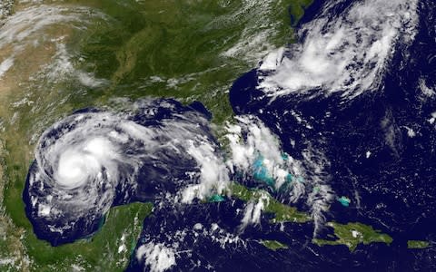 Thia NOAA-NASA GOES Project satellite image taken at 1737 UTC on August 24, 2017 shows storm activity off the south east coast of the US - Credit: AFP