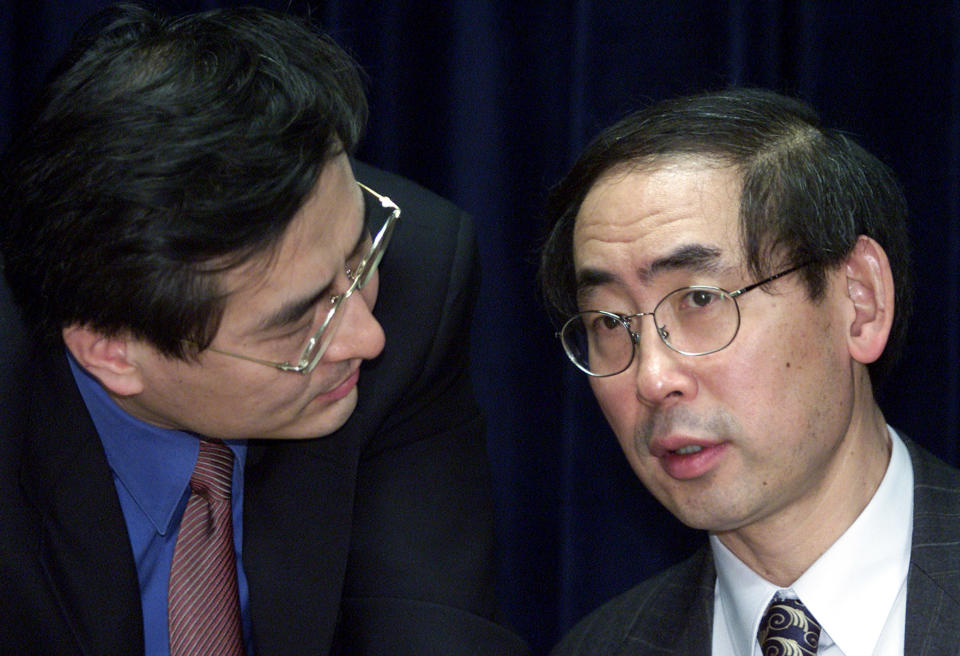 South Korean justice minister Park Sang-ki (R) at a news conference in 2002. REUTERS/Lee Jae-won
