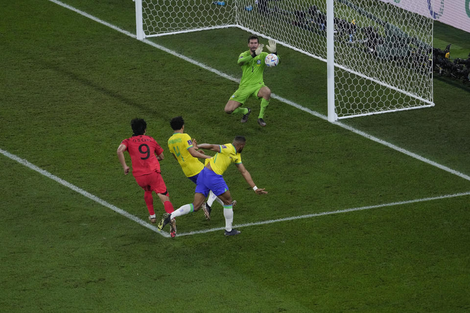 Brazil's goalkeeper Alisson, saves the ball during the World Cup round of 16 soccer match between Brazil and South Korea, at the Stadium 974 in Doha, Qatar, Monday, Dec. 5, 2022. (AP Photo/Darko Bandic)