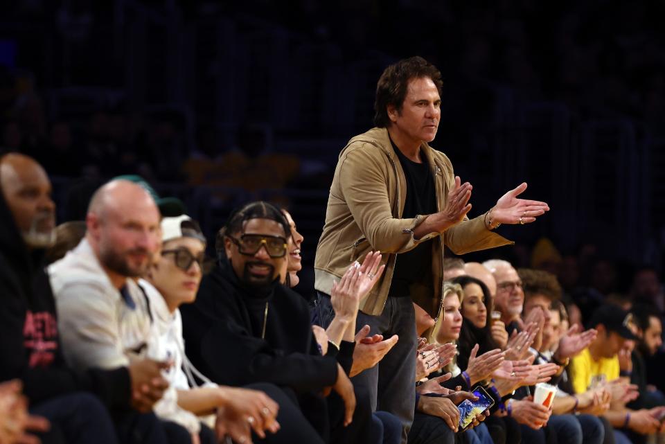 Pistons owner Tom Gores reacts to a play during the Pistons' 125-111 loss to the Lakers on Tuesday, Feb. 13, 2024, in Los Angeles.