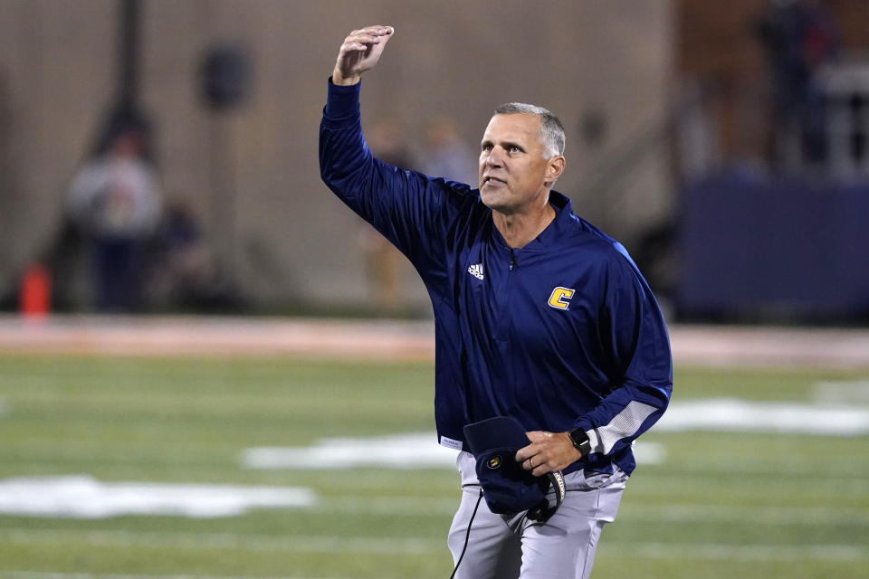 Chattanooga coach Rusty Wright gestures along a sideline during the first half of the team's NCAA college football game against Illinois on Thursday, Sept. 22, 2022, in Champaign, Ill. (AP Photo/Charles Rex Arbogast)