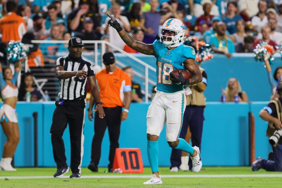 Aug 17, 2024; Miami Gardens, Florida, USA; Miami Dolphins wide receiver Erik Ezukanma (18) reacts after catching the football against the Washington Commanders during the third quarter of a preseason game at Hard Rock Stadium. Mandatory Credit: Sam Navarro-USA TODAY Sports