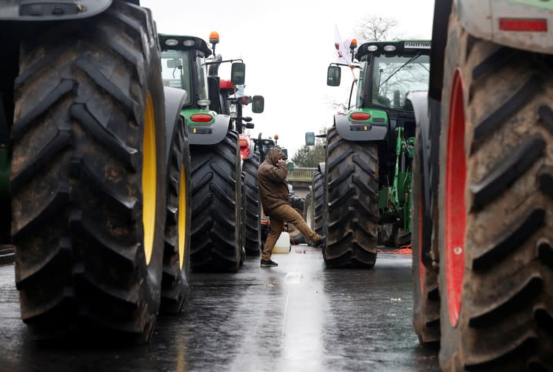 French farmers block the ring road with their tractors during a day of protest in Paris