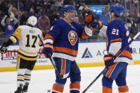 New York Islanders' Kyle Palmieri, right, celebrates his goal against the Pittsburgh Penguins with Samuel Bolduc during the second period of an NHL hockey game Wednesday, April 17, 2024, in Elmont, N.Y. (AP Photo/Seth Wenig)