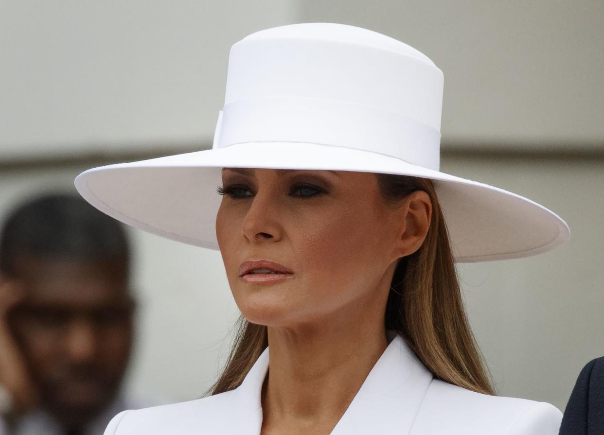 Then-First Lady Melania Trump waits to greet French President Emmanuel Macron and his wife Brigitte Macron at the White House on April 24, 2018.