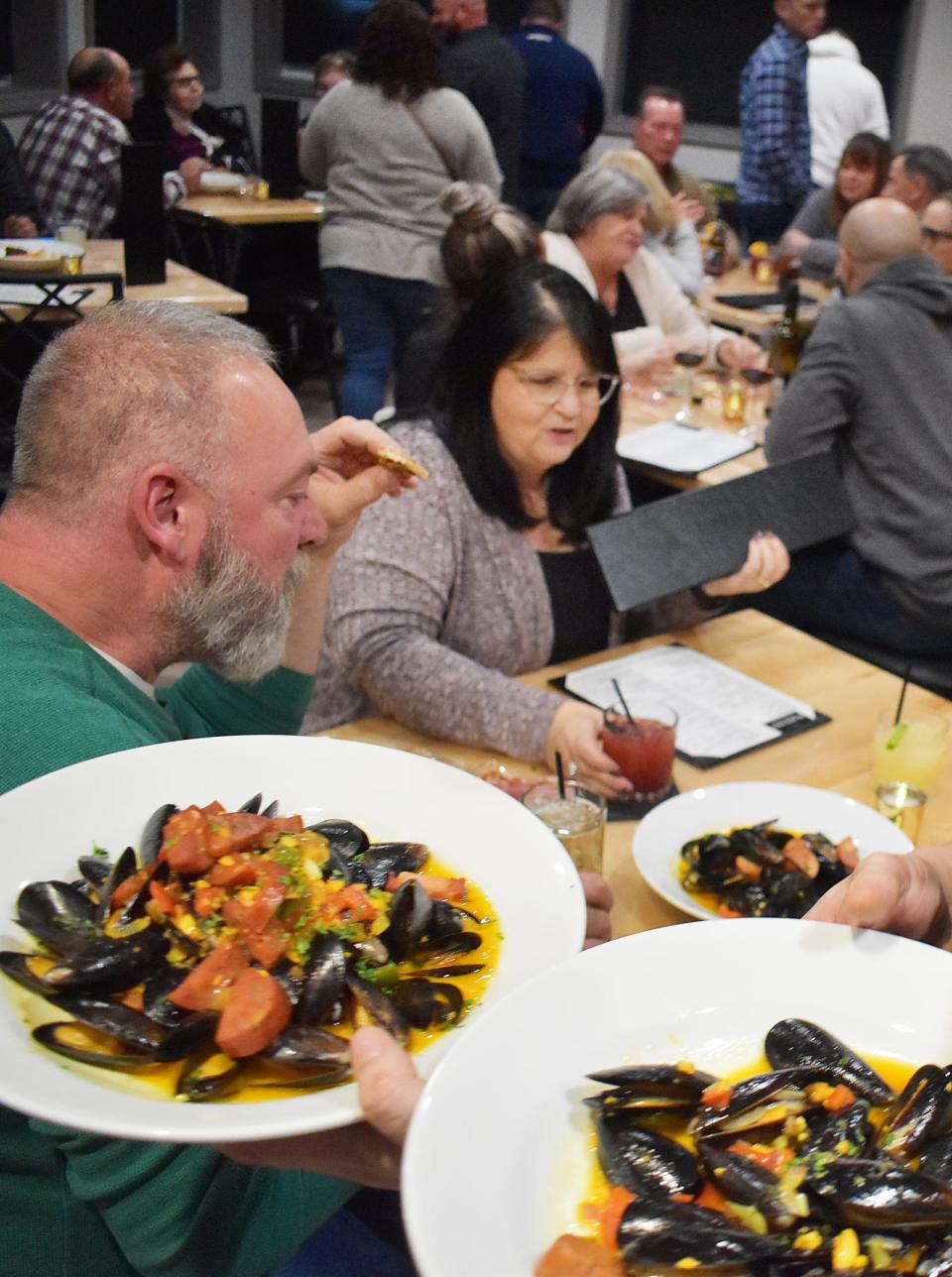 Diners enjoy dinner at Black Salt's soft opening Thursday, Nov. 17, 2022, in Swansea.