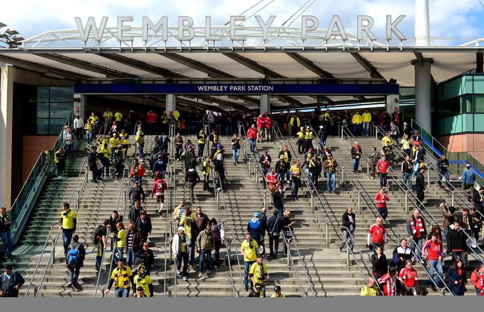 Fans make their way from Wembley Park Station near Wembley Stadium before the game.