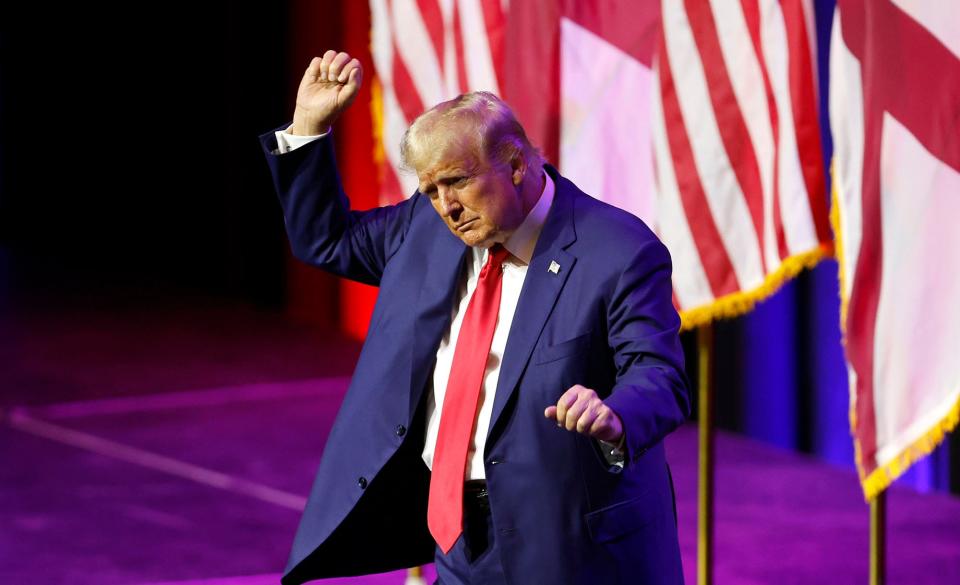 Former President Donald Trump dances after speaking at a fundraiser for the Alabama Republican party on Friday, Aug. 4, 2023, in Montgomery, Alabama.