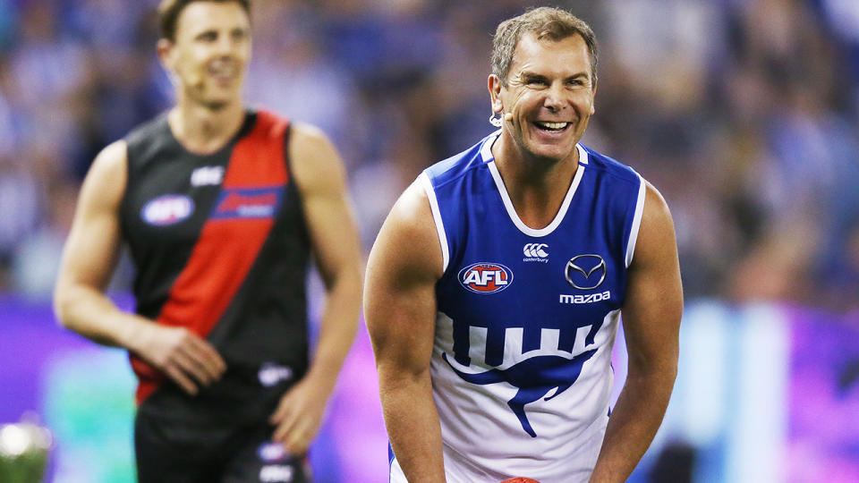 Wayne Carey is pictured wearing a North Melbourne jumper for a charity event.