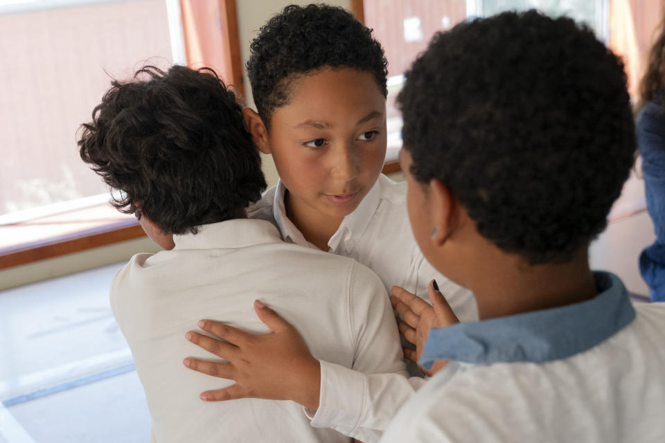 Isaac Harrison, 10, of Oakland, Calif., is embraced by his new friends, including Naftali Torres, 10, also of Oakland, left, and Mkale Friedman, 10, of Philadelphia, as Isaac prepares to leave Camp Be’chol Lashon, a sleepaway camp for Jewish children of color, Saturday, July 29, 2023, in Petaluma, Calif., his first experience at the camp held at Walker Creek Ranch. He went to a traditional Jewish summer camp last year and said he was bullied by some campers for being Black. “They were just being really mean, but here no one’s mean like that,” said Harrison. (AP Photo/Jacquelyn Martin)