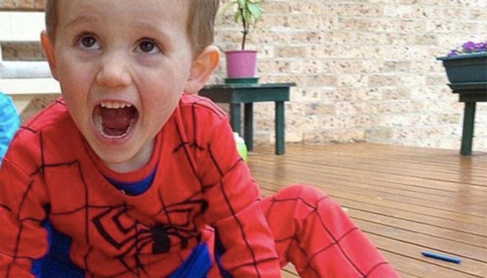 William Tyrrell pictured on a deck wearing a spider man costume.