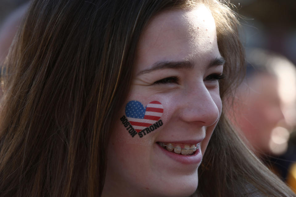 Sophie Ordman, of Calgary, Alberta, awaits the start of the 118th Boston Marathon Monday, April 21, 2014 in Boston. Her mother is competing in the race. (AP Photo/Matt Rourke)