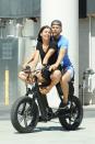 Derek Hough and girlfriend Hayley Erbert go for a cruise on an electric bike on Friday in Sherman Oaks, California.