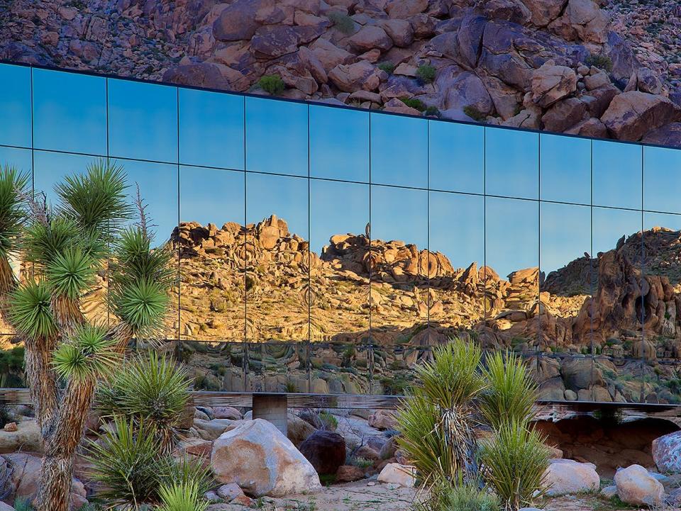 Invisible House desert reflected in the windows of the house