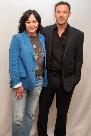 <p>Vera Anderson/WireImage</p> Shannen Doherty and Brian Austin Green pose at the "BH90210" press conference in 2019