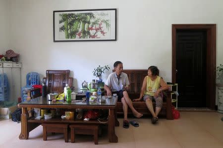 Yang Zhen, wife of arrested village chief Lin Zuluan, talks with another villager in her family's home in Wukan village in the southern province of Guangdong, China June 23, 2016. Picture taken June 23, 2016. REUTERS/James Pomfret