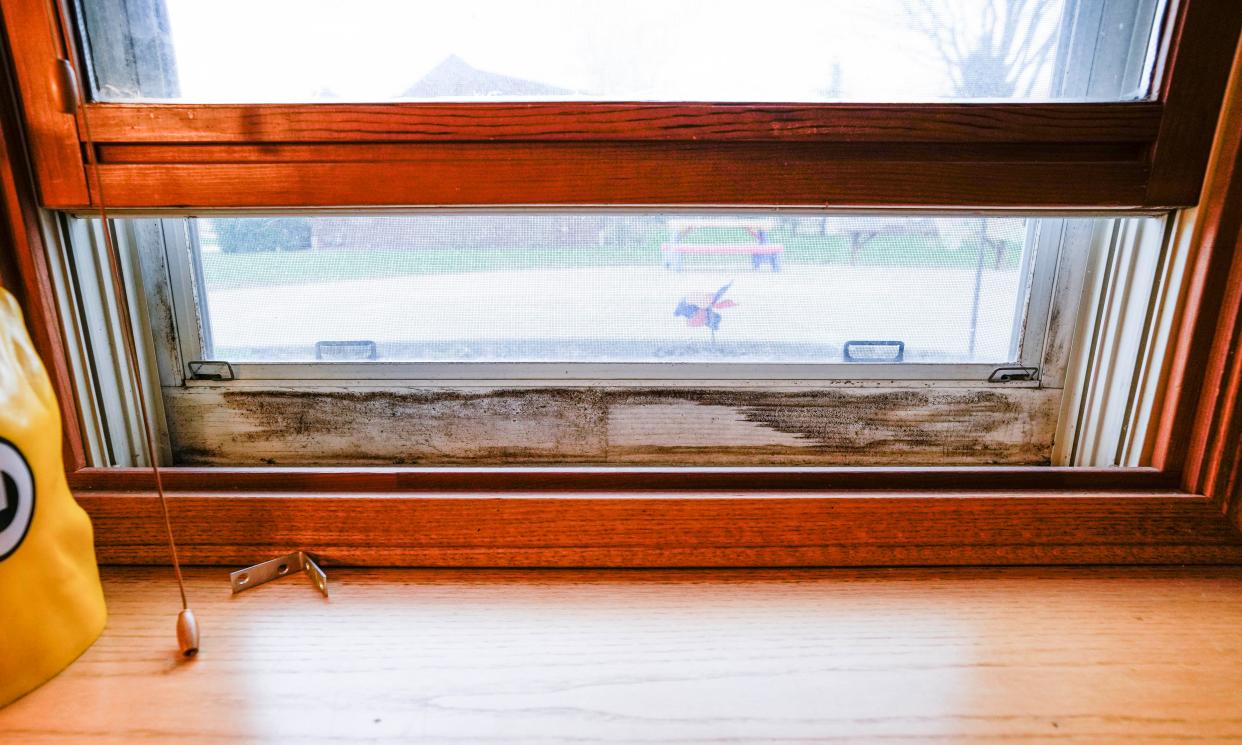 Homeowners Nicole and Brandon Luterbach are constantly trying to clean mold and mildew from the original wooden window frames in their Sussex home as seen on Monday, April 25, 2022. The couple paid out $20k to a company called Window Select for new windows in 2021 but has never received them.