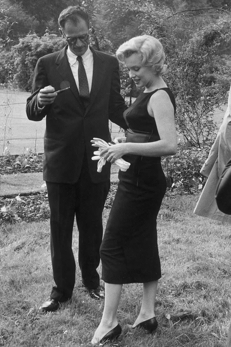 <p>Marilyn Monroe's chic figure-hugging black sheath dress proves that less is always more. </p>