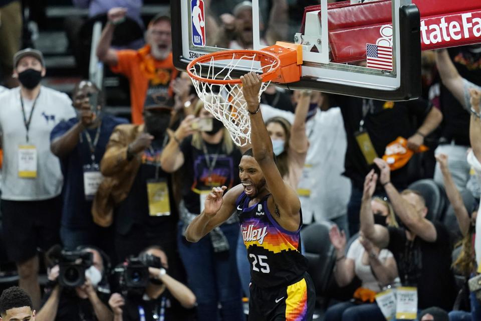 Phoenix Suns forward Mikal Bridges celebrates his dunk against the Los Angeles Clippers during the second half of Game 1 of the NBA basketball Western Conference finals Sunday, June 20, 2021, in Phoenix . (AP Photo/Ross D. Franklin)