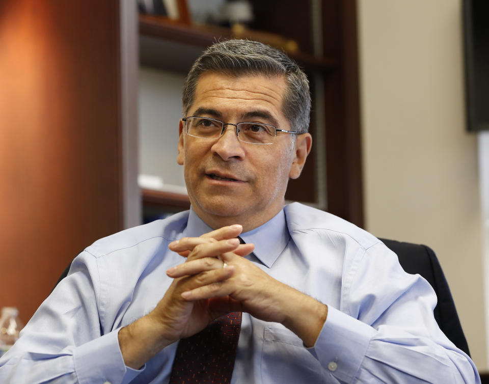 In this Oct. 10, 2018 photo, California Attorney General Xavier Becerra discusses various issues during an interview with The Associated Press, in Sacramento, Calif. As the state's first Latino attorney general, Becerra is uniquely positioned to opposed the Trump administration's immigration crackdown. He says he’s forced to sue Trump to defend California’s people, values and resources. (AP Photo/Rich Pedroncelli)