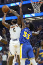 Denver Nuggets center DeAndre Jordan (6) is fouled while shooting against Golden State Warriors center James Wiseman (33) during the first half of an NBA basketball game in San Francisco, Friday, Oct. 21, 2022. (AP Photo/Jeff Chiu)