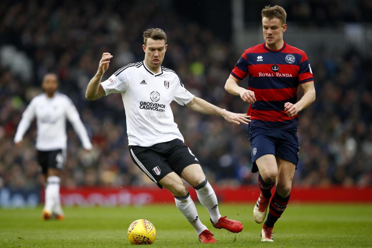 Smith battles with Fulham's Kevin McDonald at Craven Cottage: Getty Images