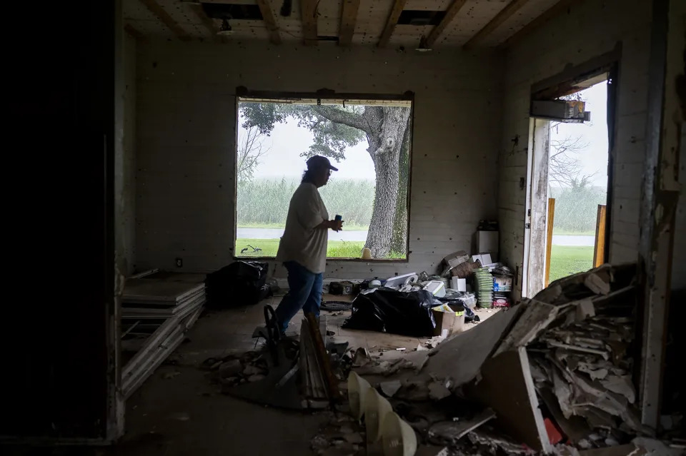 Susie Fawvor in her family home, which has withstood every major hurricane since its construction in 1915, but was damaged in Hurricane Laura in 2020, in Grand Chenier, La., Sept. 3, 2022. (Emily Kask/The New York Times)
